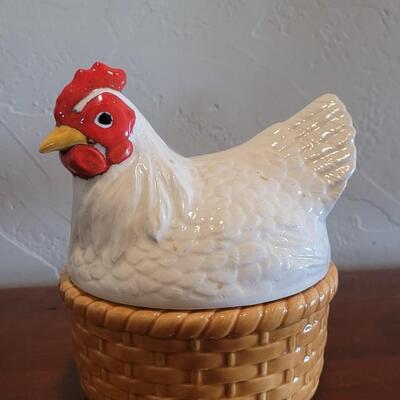 Lot 591: Ceramic Hen Sitting on a Basket Dish