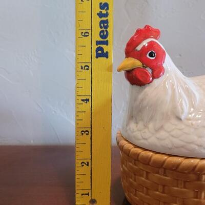 Lot 591: Ceramic Hen Sitting on a Basket Dish