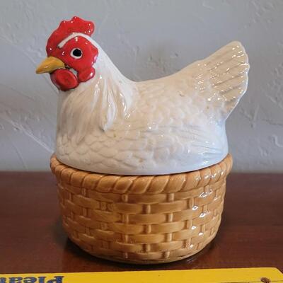 Lot 591: Ceramic Hen Sitting on a Basket Dish