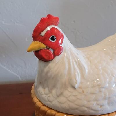 Lot 591: Ceramic Hen Sitting on a Basket Dish