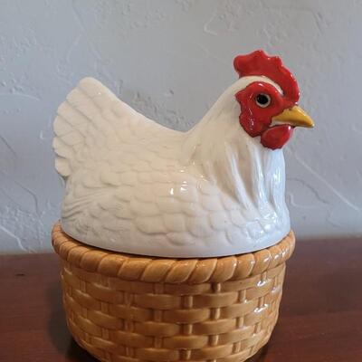 Lot 591: Ceramic Hen Sitting on a Basket Dish
