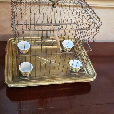 Small bird cage 11 inches high with four ceramic feeders