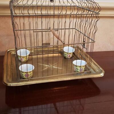 Small bird cage 11 inches high with four ceramic feeders