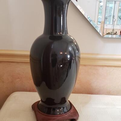 Tall black vase on stand