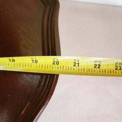 Three tiered table with brass feet