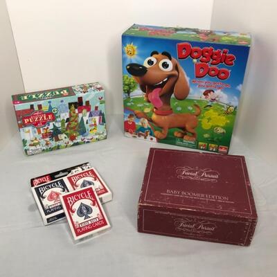 Assorted games puzzle and decks of new cards unopened