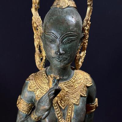 An Elongated Bronze Female Apsara Venerated Figure