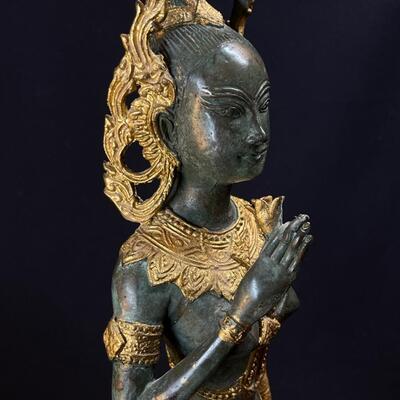 An Elongated Bronze Female Apsara Venerated Figure