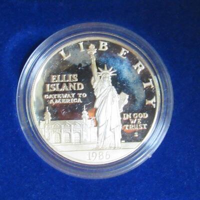 US Mint 1986 S Liberty, Ellis Island Silver Dollar (.77 troy oz), and Clad Half Dollar Proof Set, Never Opened