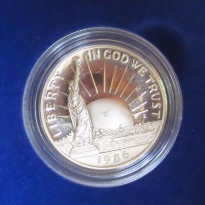 US Mint 1986 S Liberty, Ellis Island Silver Dollar (.77 troy oz), and Clad Half Dollar Proof Set, Never Opened