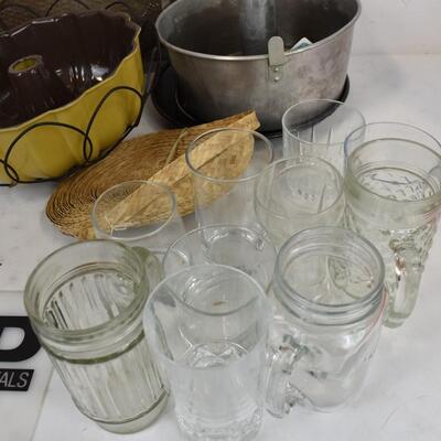 Large Basket, Bunt cake pans, assorted glass cups and mugs.