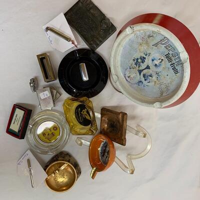 Vintage lot of ashtrays, matchbox covers, lighter and tobacco snuffers.