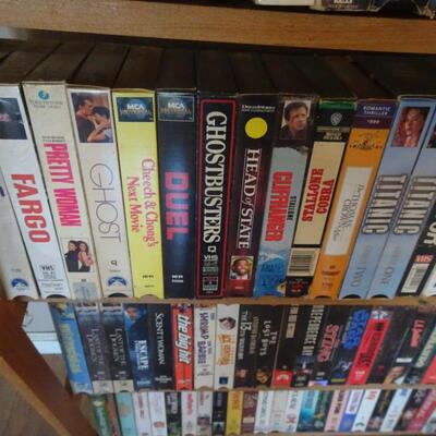 LOT 812.  VHS COLLECTION AND STORAGE RACK