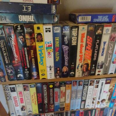 LOT 812.  VHS COLLECTION AND STORAGE RACK