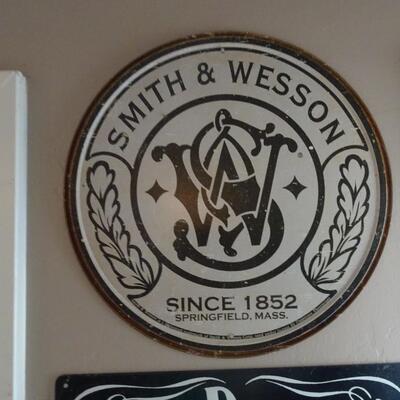 LOT 828. METAL SMITH AND WESSON AND JACK DANIEL'S SIGN
