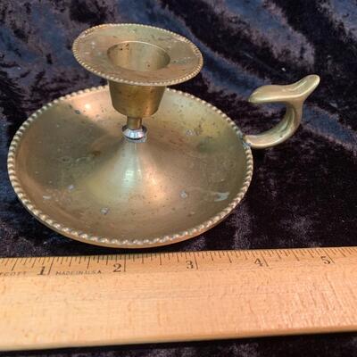 Antique and authentic collection of hand held candle sticks, trivets, etc...