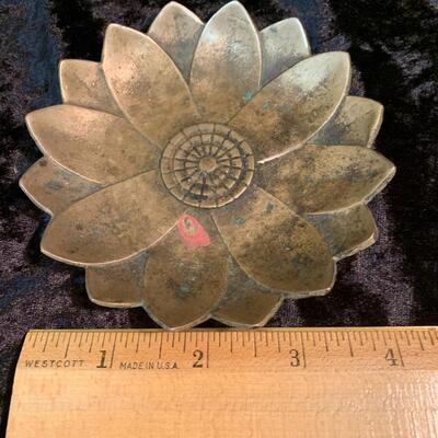 Antique and authentic collection of hand held candle sticks, trivets, etc...