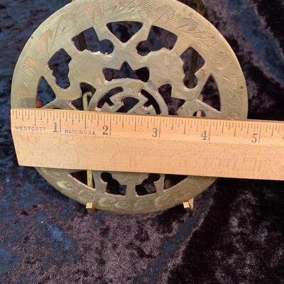 Antique and authentic collection of hand held candle sticks, trivets, etc...