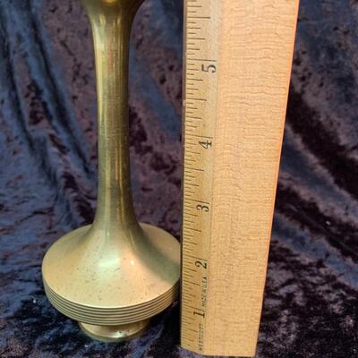 Antique and authentic collection of hand held candle sticks, trivets, etc...