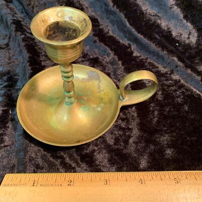 Antique and authentic collection of hand held candle sticks, trivets, etc...