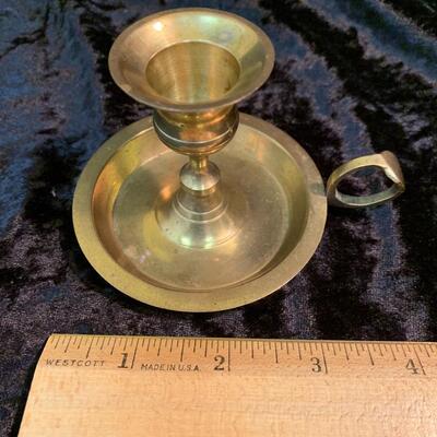 Antique and authentic collection of hand held candle sticks, trivets, etc...