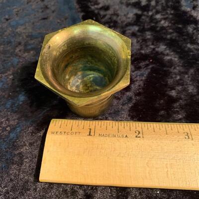 Antique and authentic collection of hand held candle sticks, trivets, etc...