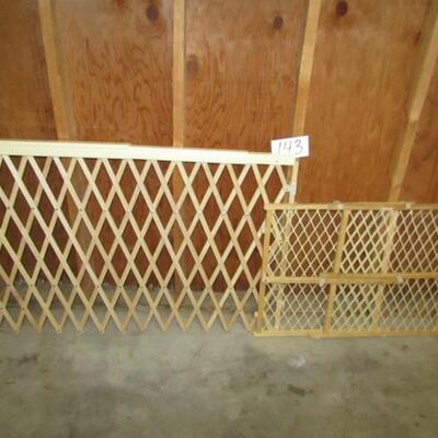 LOT 143  TWO BABY GATES