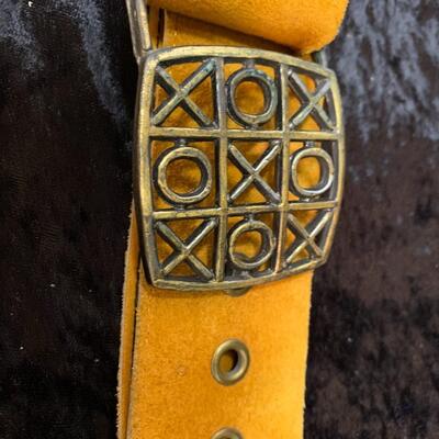 Vintage belts, perfume and other things in the bathroom cabinet