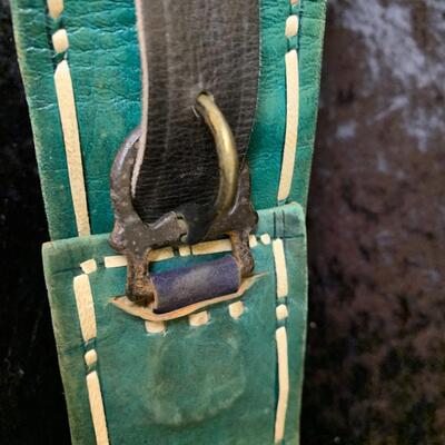 Vintage belts, perfume and other things in the bathroom cabinet