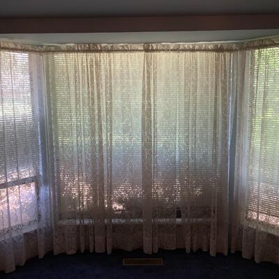 Wall of lace curtains