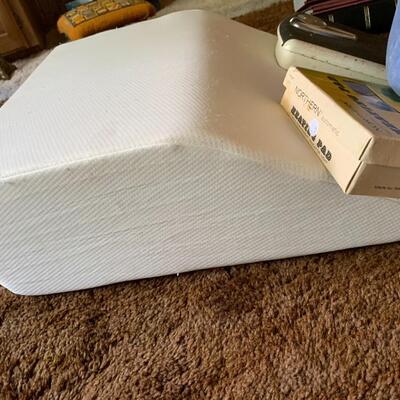 Lot of vintage scale, heating pad, blankets, travel pillow and wedge pillow.