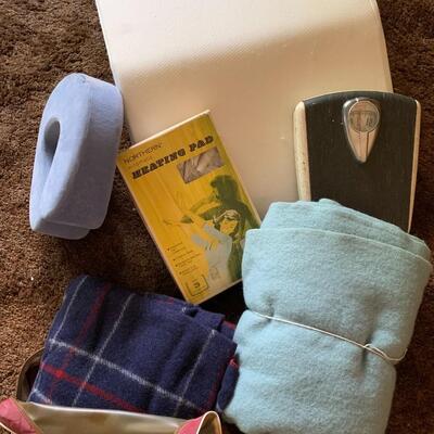 Lot of vintage scale, heating pad, blankets, travel pillow and wedge pillow.
