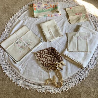 6 vintage tablecloths, a runner and a bonnet.
