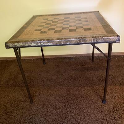 Well used vintage checker board card table