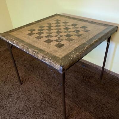 Well used vintage checker board card table
