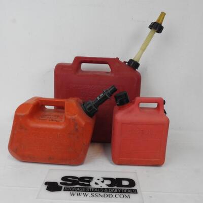 3 Plastic gas cans- 1,2,and 5 gallon cans