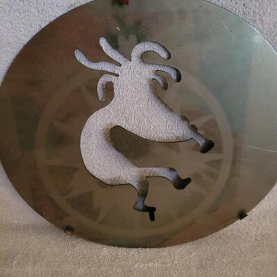 Kokopelli cut in metal