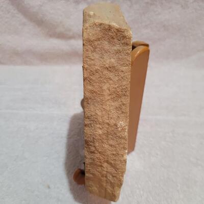 Wolf face on sandstone
