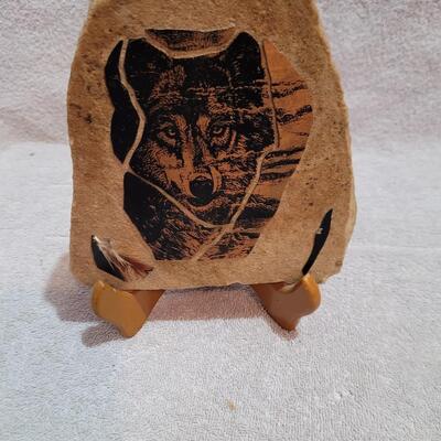 Wolf face on sandstone