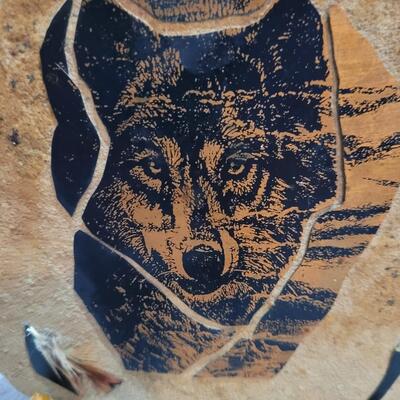 Wolf face on sandstone