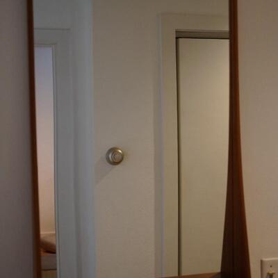 TEAK WALL MIRROR WITH GRADUATED SIDES THAT FORM A SHELF AT THE BOTTOM