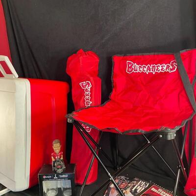 Lot 91 Buccaneers Tailgate: Pair of Folding Chairs, Cooler, Tom Brady Bobblehead, Super Bowl Glasses, and Magazines