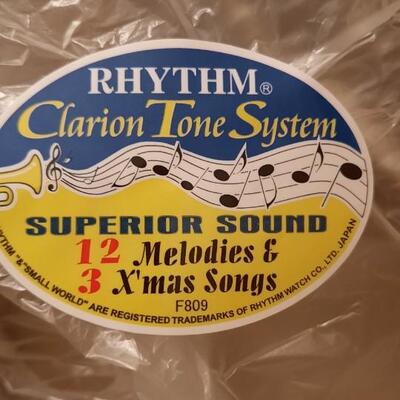 Lot 106  Cuorum Small World Rhythm Clock - Plays 12 Melodies & 3 Christmas Songs