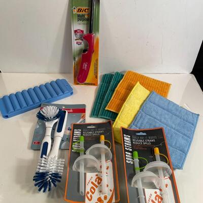 Lot 142  Lighter, Sponges, Soda Can Lids, Cleaning Brush and Ice Tray.