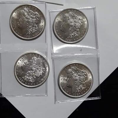 4 Brilliant uncirculated  1921 Morgan silver dollars .Reserve set