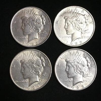 4 Brilliant uncirculated  Peace dollars 1922,23,24,25. Reserve set