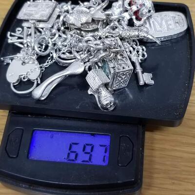 Sterling silver hand made  charm bracelet  69.7 g.  Reserve set