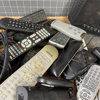 #138 Remotes and Cords and modems 