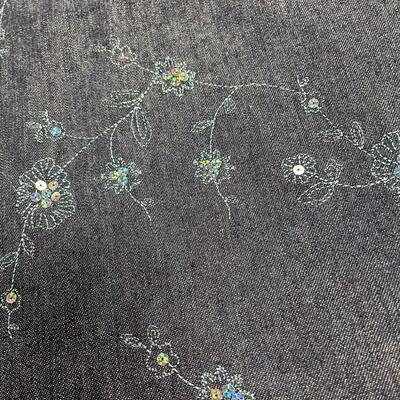 Denim material with sequin design flowers and butterflies