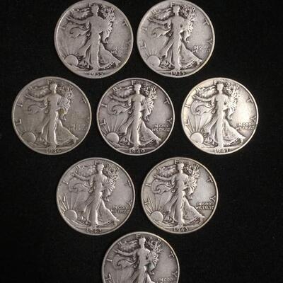 8 Walking liberty half dollars. Reserve